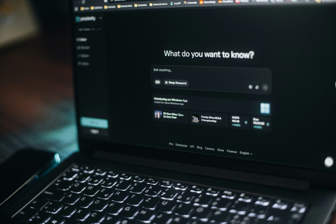 Small business owner using AI tools for marketing tasks on a laptop