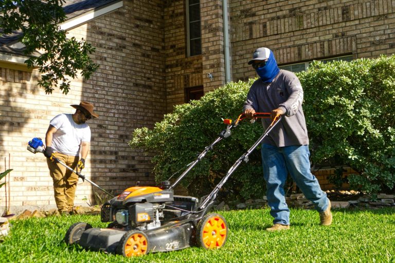 men from lawn mowing business working